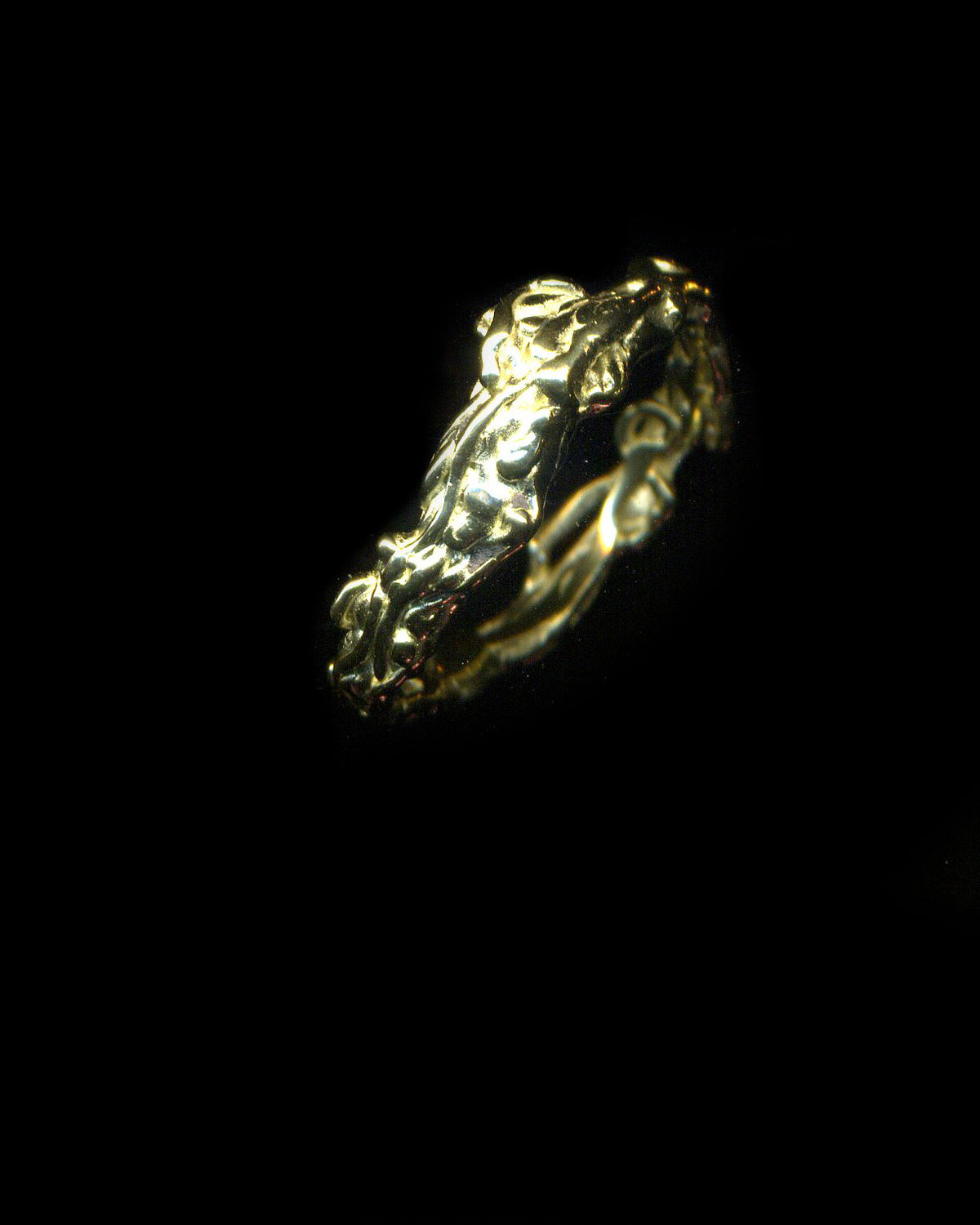 Sculptural Fine Doodler ring in 14-carat yellow gold against black